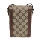 Gucci handbag with monogram pattern on a white background