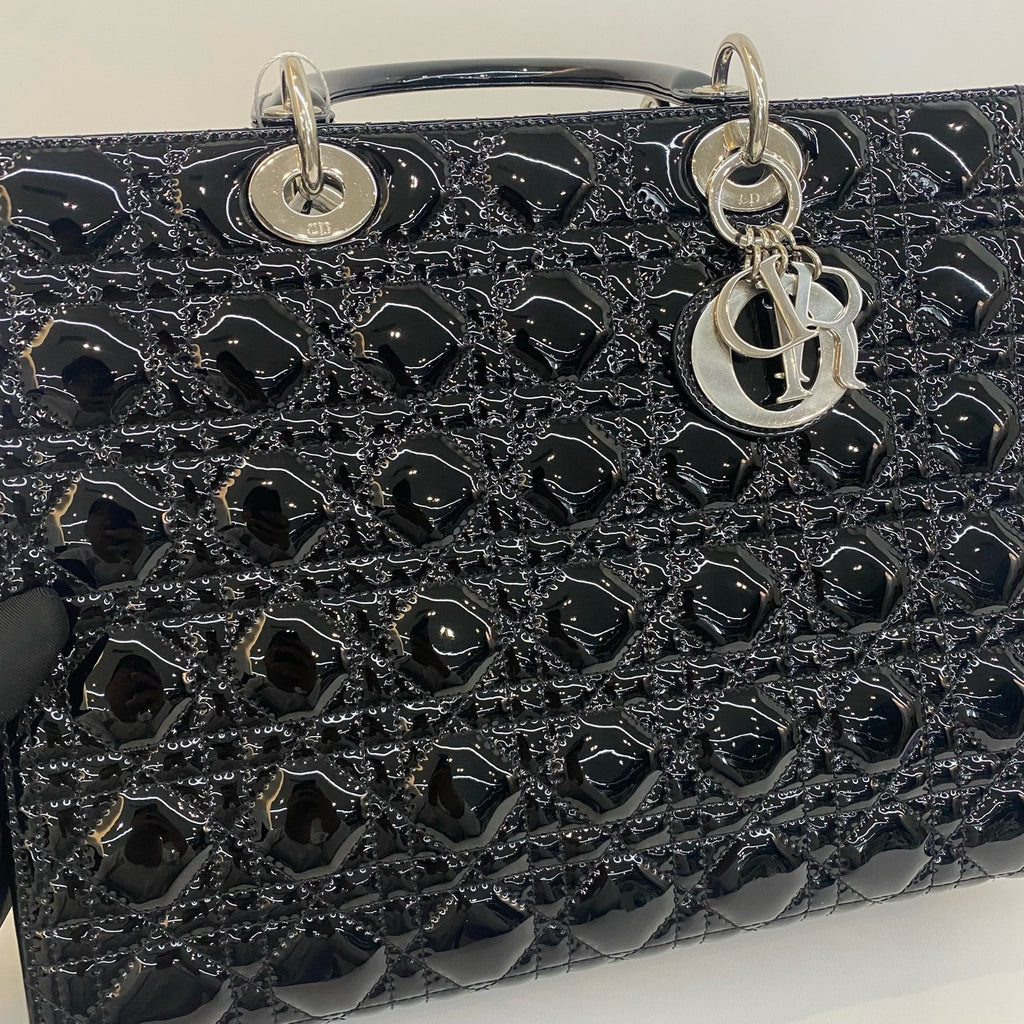 preowned dior handbag with strap with the dior lucky charm 