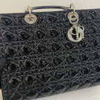 preowned dior handbag with strap with the dior lucky charm 
