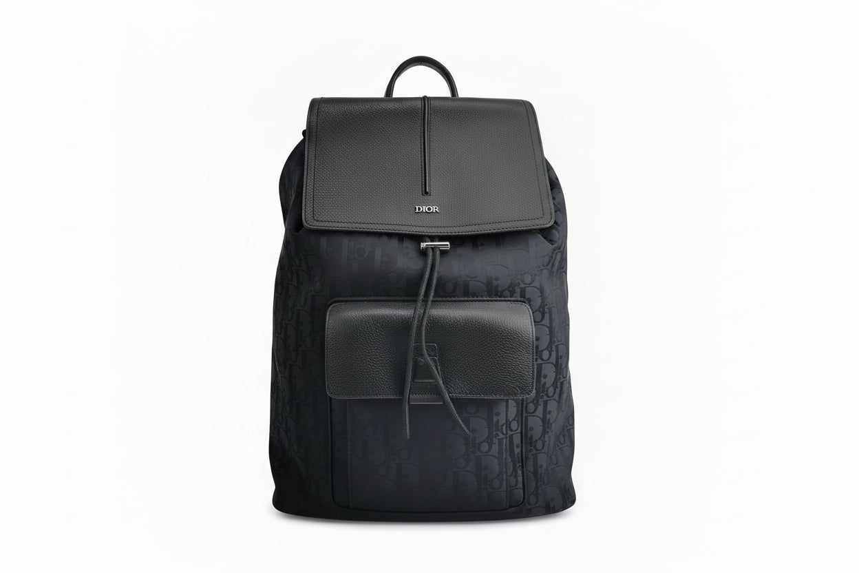 front look of christian dior black oblique canvas and leather cover men's backpack in excellent condition