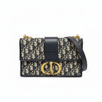 preowned authentic christian dior black and grey oblique monogram 30 montaigne crossbody bag with cd gold hardware logo in very good condition for sale preloved luxury designer bag at discount price 