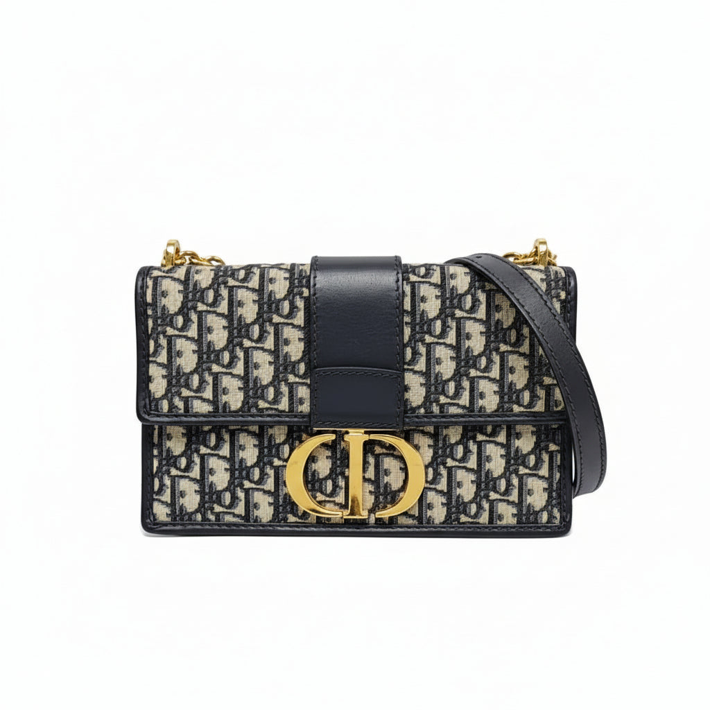 preowned authentic christian dior black and grey oblique monogram 30 montaigne crossbody bag with cd gold hardware logo in very good condition for sale preloved luxury designer bag at discount price 