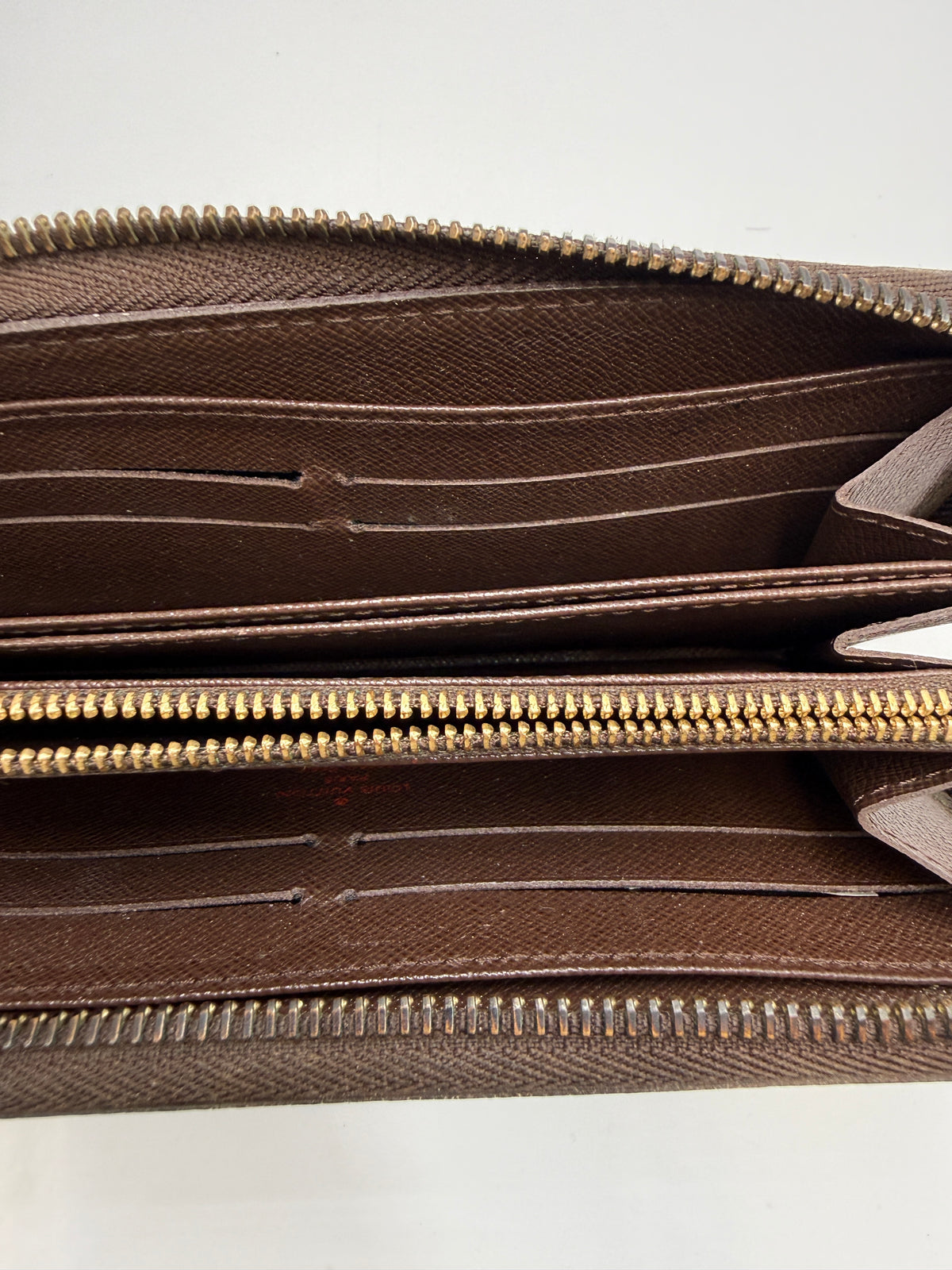 Louis Vuitton Zippy Wallet in Damier Ebene Canvas