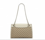 the back view of pre-owned Gucci Beige gg canvas with white leather and silver chain shoulder strap in very good condition 