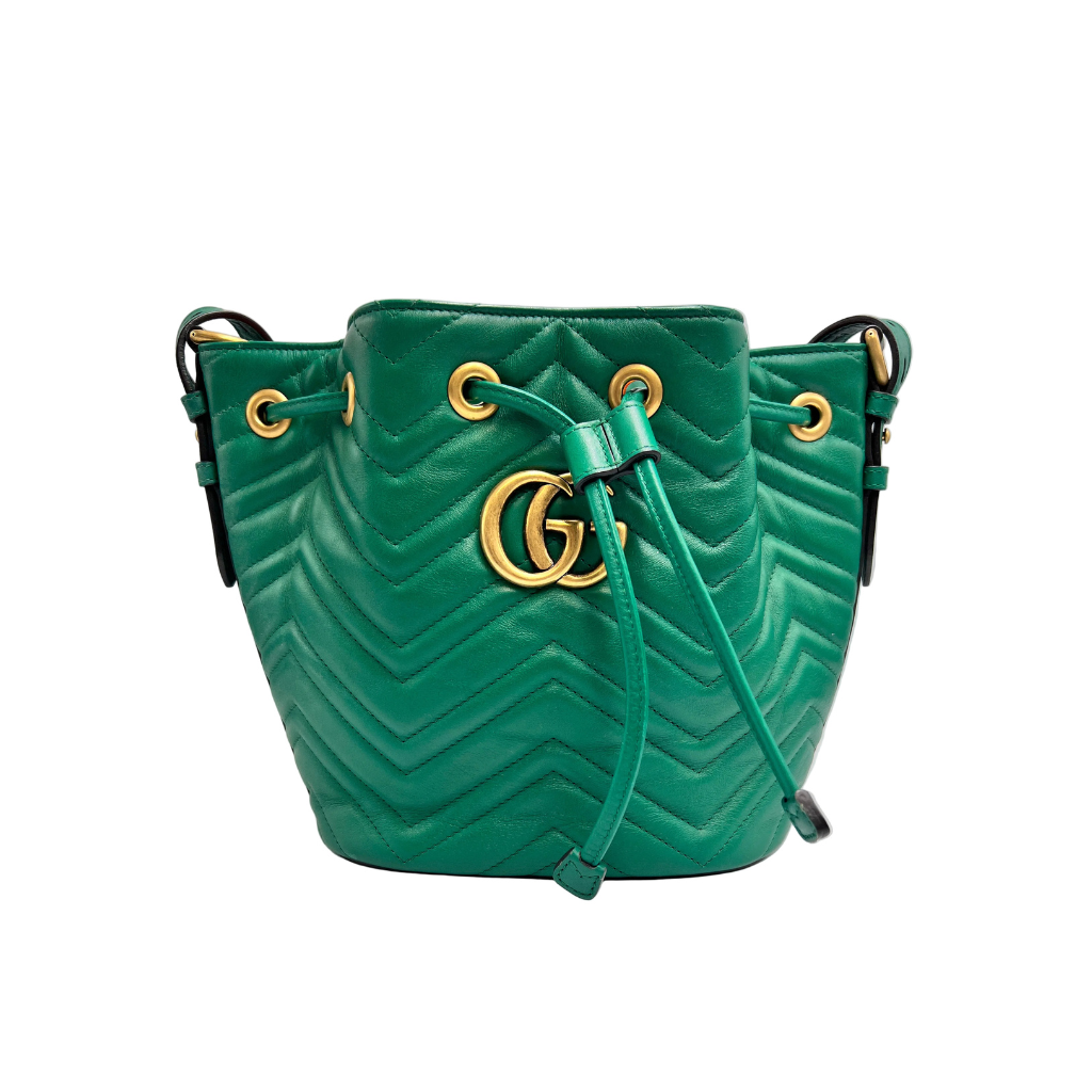front view of green gucci marmont bucket bag with gold hardwware 