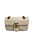 Authentic pre-owned Gucci GG Marmont matelassé small shoulder bag in white leather (22cm) featuring antique gold double G hardware and sliding chain strap.