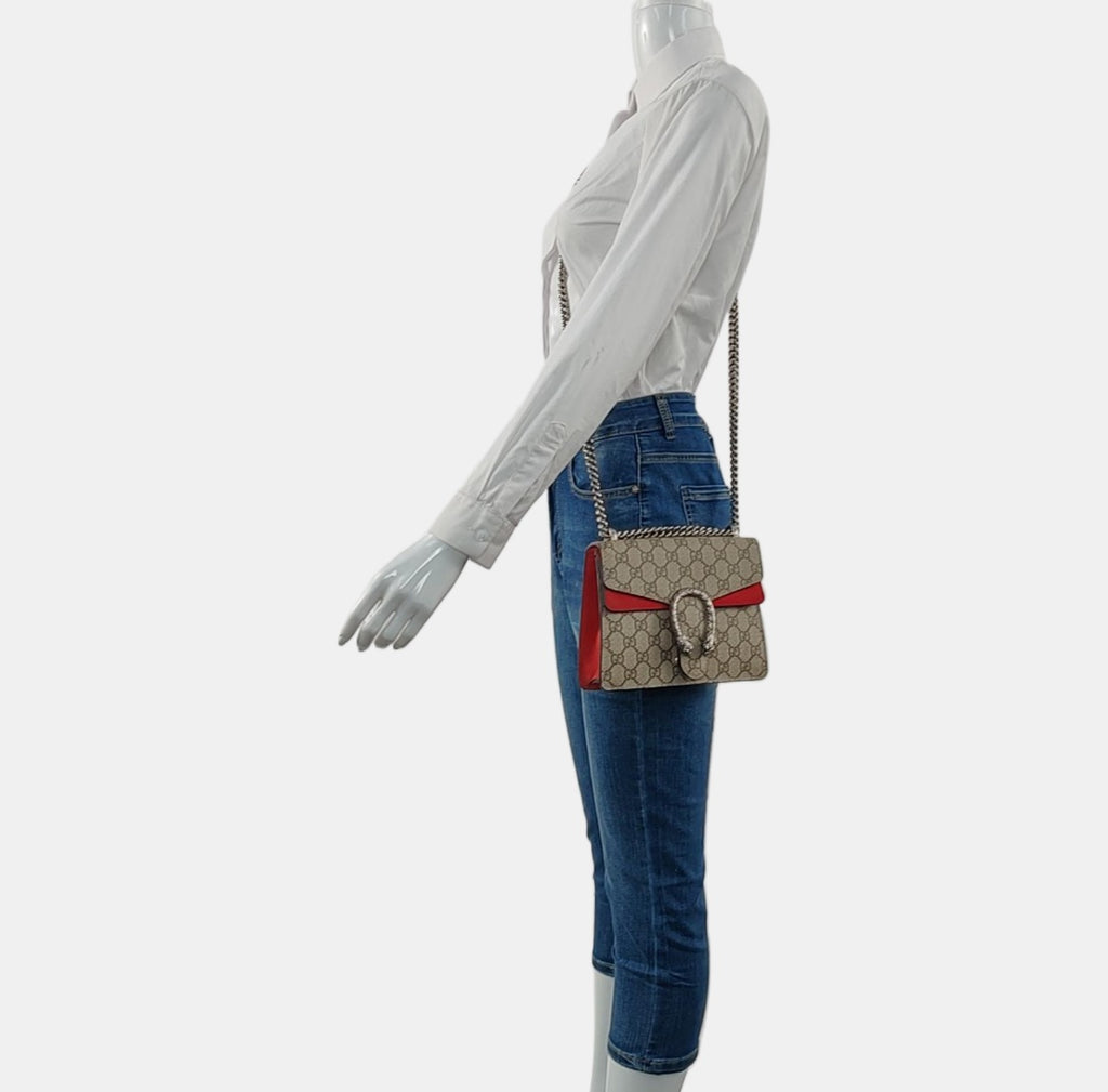 preowned authentic gucci gg canvas with red suede detail and silver crossbody strap handbag for size reference