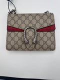 Authentic pre-owned Gucci Dionysus small shoulder bag in signature GG Supreme canvas with red suede details and antique silver-tone tiger head closure.