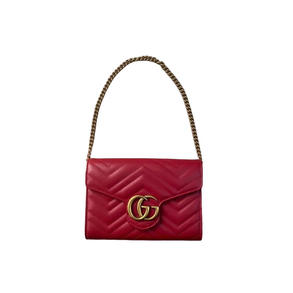 Shop this pre-loved Gucci GG Marmont Small Shoulder Bag in red matelassé leather. Featuring iconic Double G hardware, chain strap, and timeless Gucci style. Authenticated luxury at Elite Luxury London.