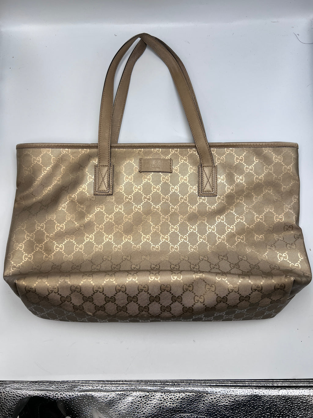 Gucci GG Monogram metallic gold coated canvas tote bag with shoulder straps