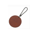 Brown leather keychain with a skull design on a white background