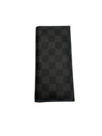 A black and dark gray checkered leather wallet, featuring a textured checkerboard pattern, shown closed on a plain white background.