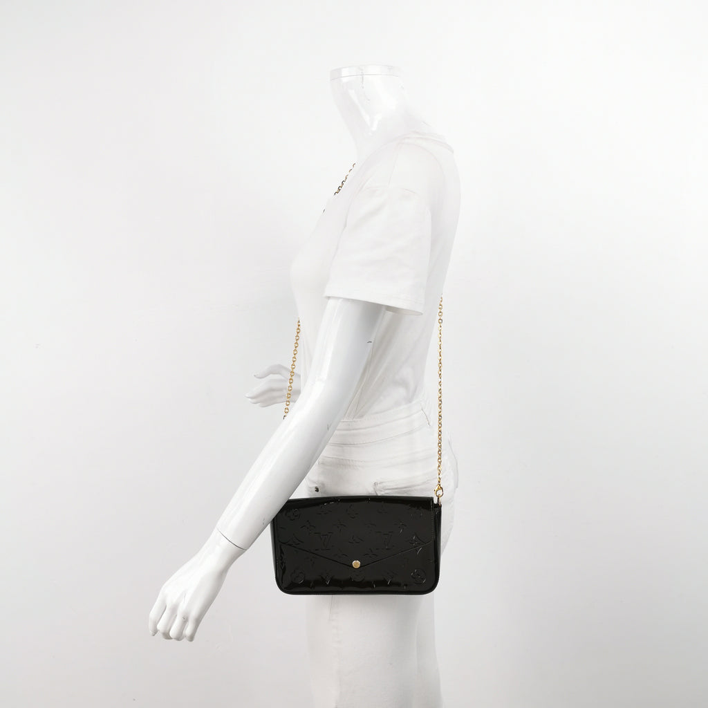 preloved Louis Vuitton pochette felicie black patent leather worn on mannequin for size reference
