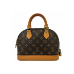Designer handbag with monogram pattern on a white background