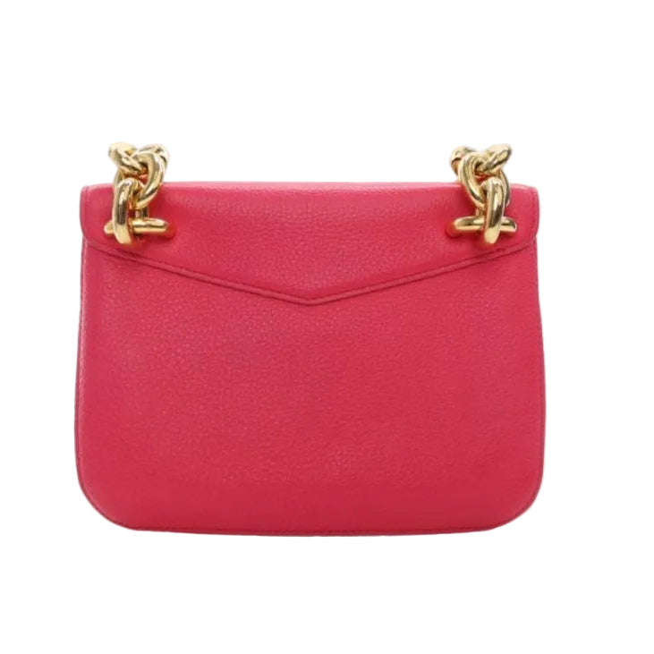 Pink handbag with gold chain straps on a white background