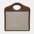 the back view of preowned burberry mini canvas pocket tophandle bag in excellent condition in brown leather and beige canvas