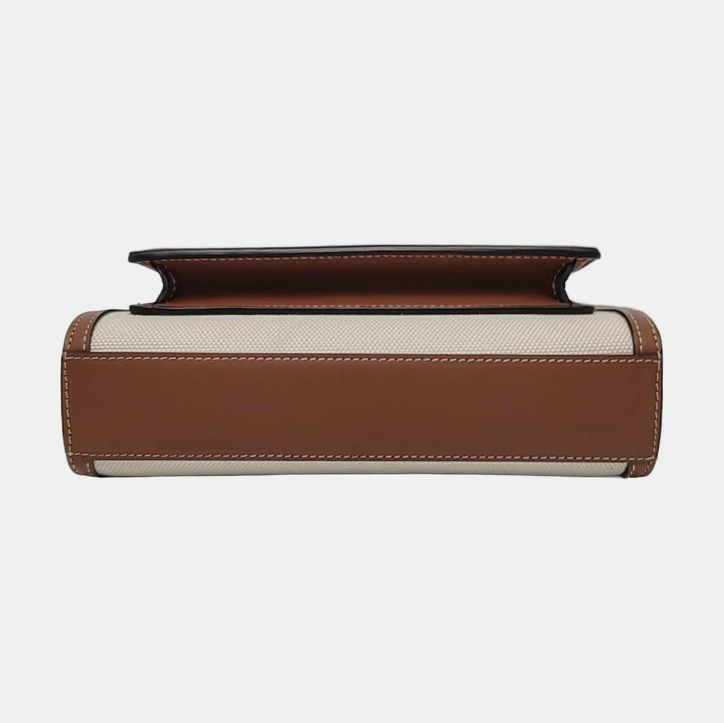 the bottom leather view of the second hand burberry mini pocket canvas bag in very good condition no damage