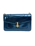 Front view of a Bvlgari Serpenti Forever shoulder bag in metallic electric blue leather with enamelled snake head closure.