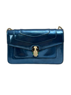 Front view of a Bvlgari Serpenti Forever shoulder bag in metallic electric blue leather with enamelled snake head closure.