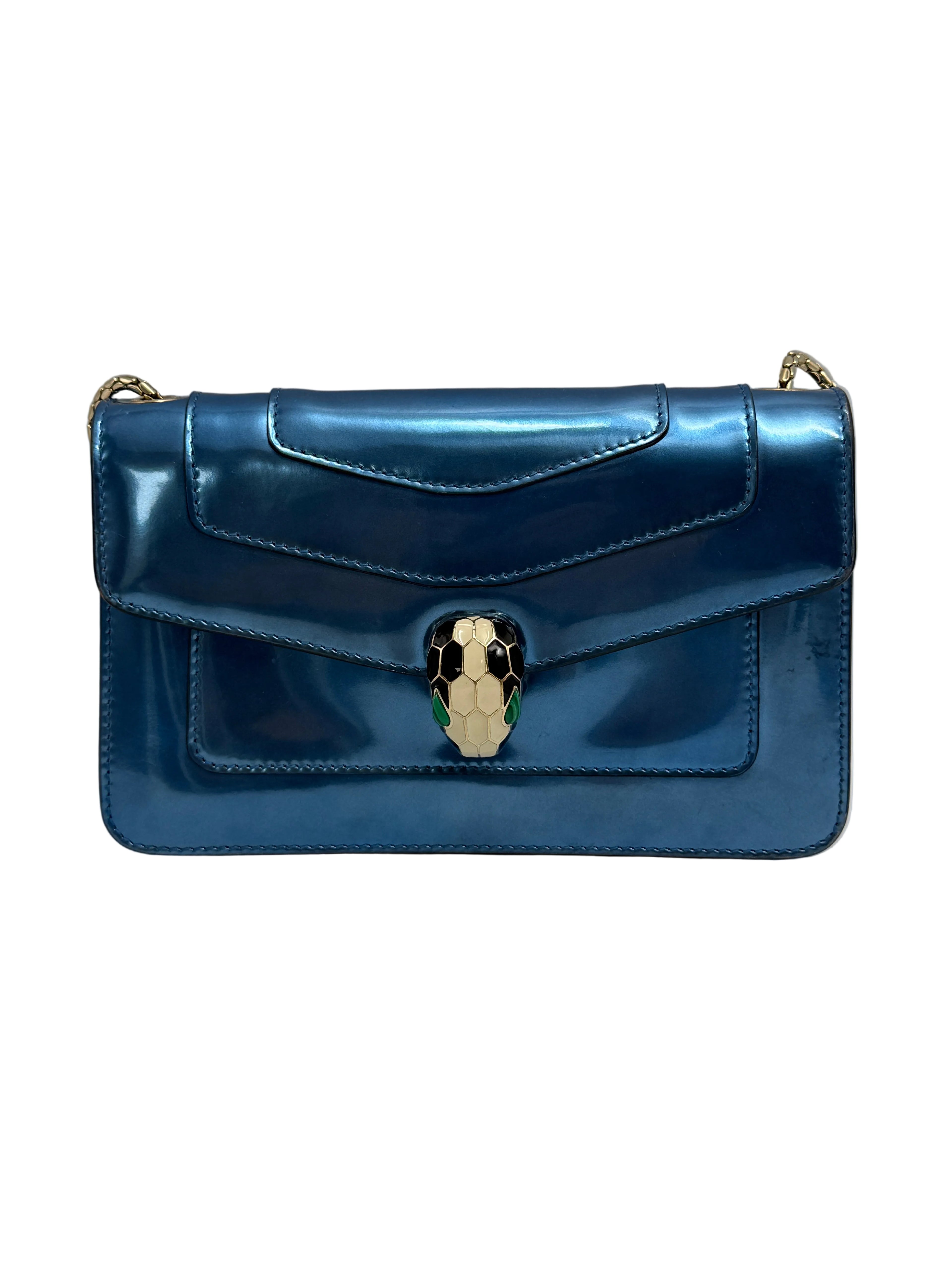 Front view of a Bvlgari Serpenti Forever shoulder bag in metallic electric blue leather with enamelled snake head closure.