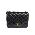 Front view of a Chanel Classic Square Mini Flap bag in black lambskin leather with gold-tone CC turnlock.