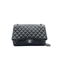 Chanel classic flap Black quilted caviar leather handbag Maxi size in very good condition crossbody luxury designer bag for sale 