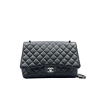 Chanel classic flap Black quilted caviar leather handbag Maxi size in very good condition crossbody luxury designer bag for sale 