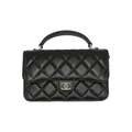 authentic preloved Black quilted handbag with Chanel logo in black lambskin leather with top handle in very good condition for sale 