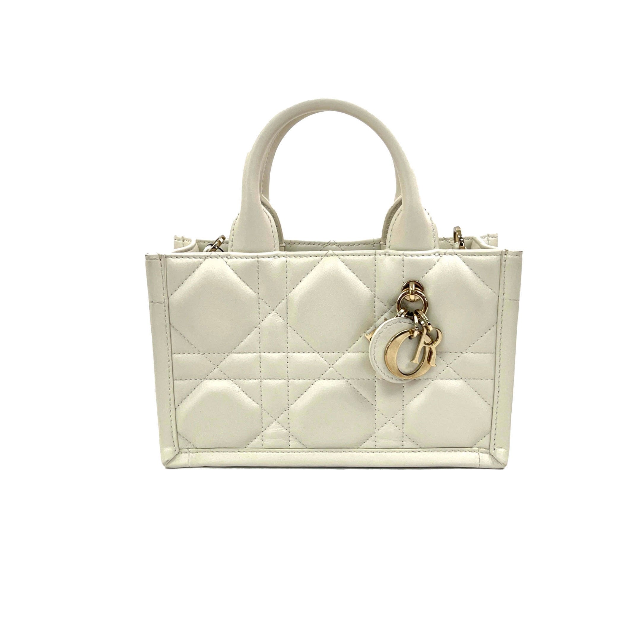 christian dior mini white leather tote bag with dior charms in gold in excellent condition for sale 