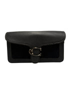A black Coach envelope clutch bag featuring pebbled leather, suede trim, and the signature C logo turn-lock closure on a light gray background.