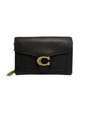 Front view of a black Coach Tabby chain clutch wallet in pebble leather featuring a crystal-embellished gold 'C' logo on the front flap.