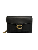 Front view of a black Coach Tabby chain clutch wallet in pebble leather featuring a crystal-embellished gold 'C' logo on the front flap.