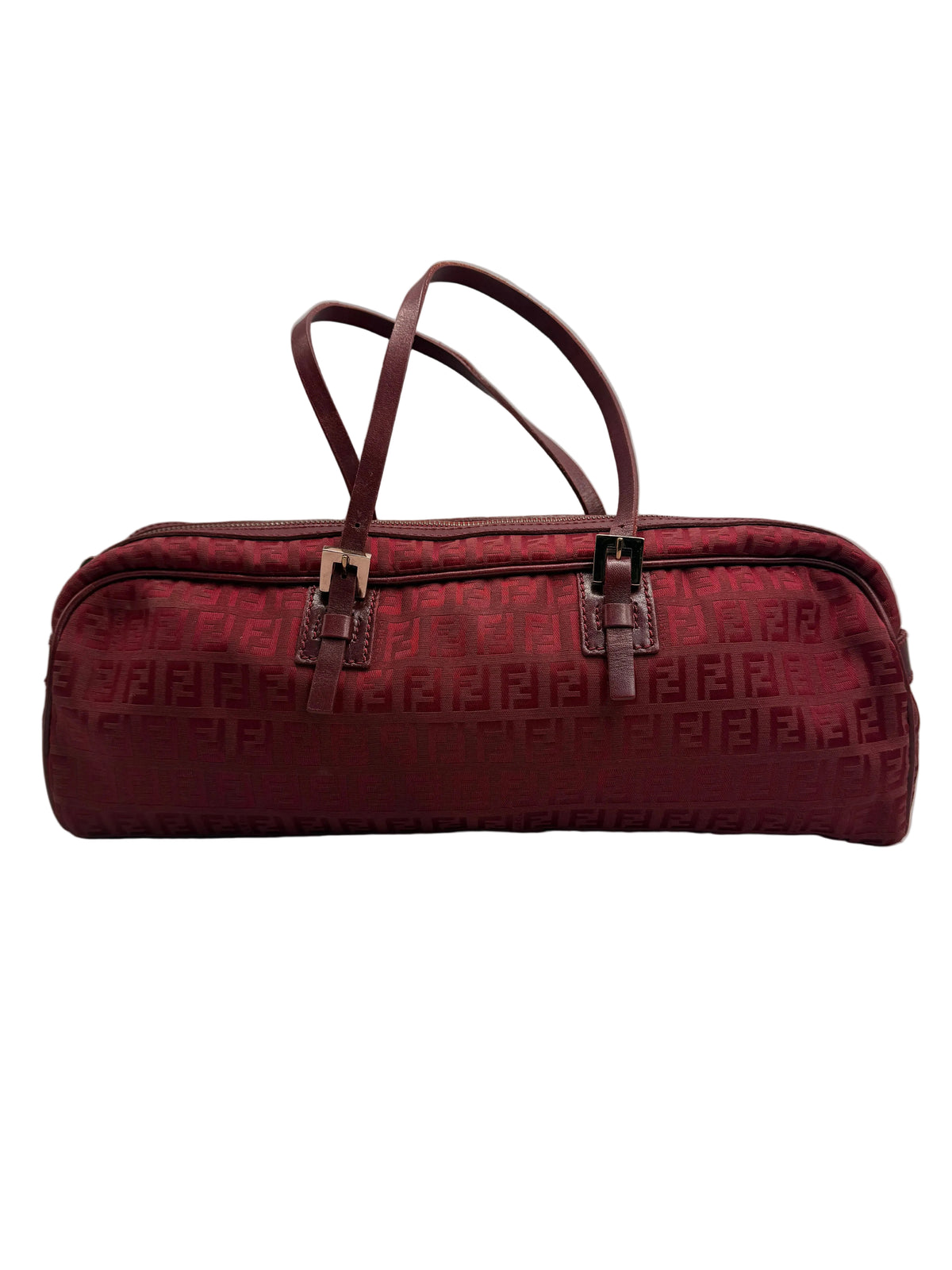 Front view of a vintage Fendi elongated cylindrical barrel shoulder bag in burgundy Zucca monogram canvas with thin leather straps.