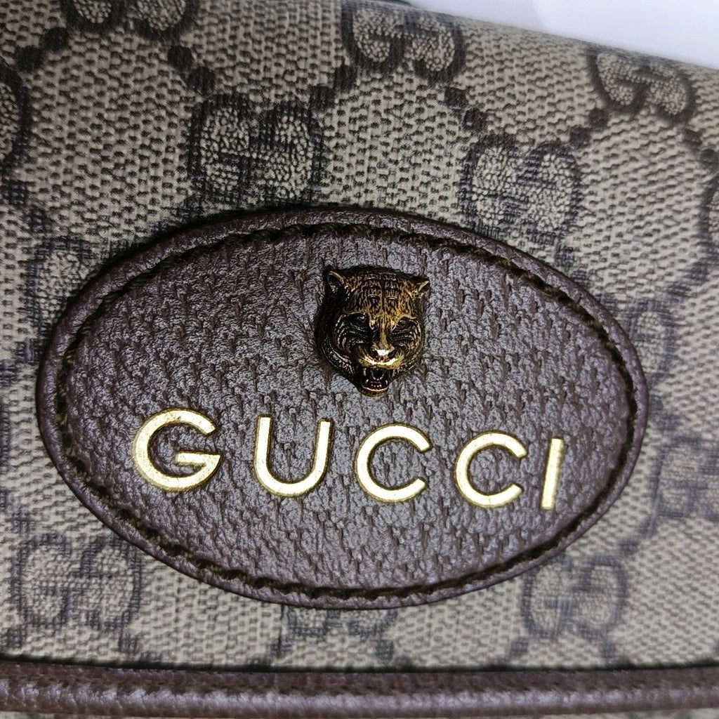 preloved gucci gg canvas supreme crossbody bag with tiger head and logo in gold in pristine condition 