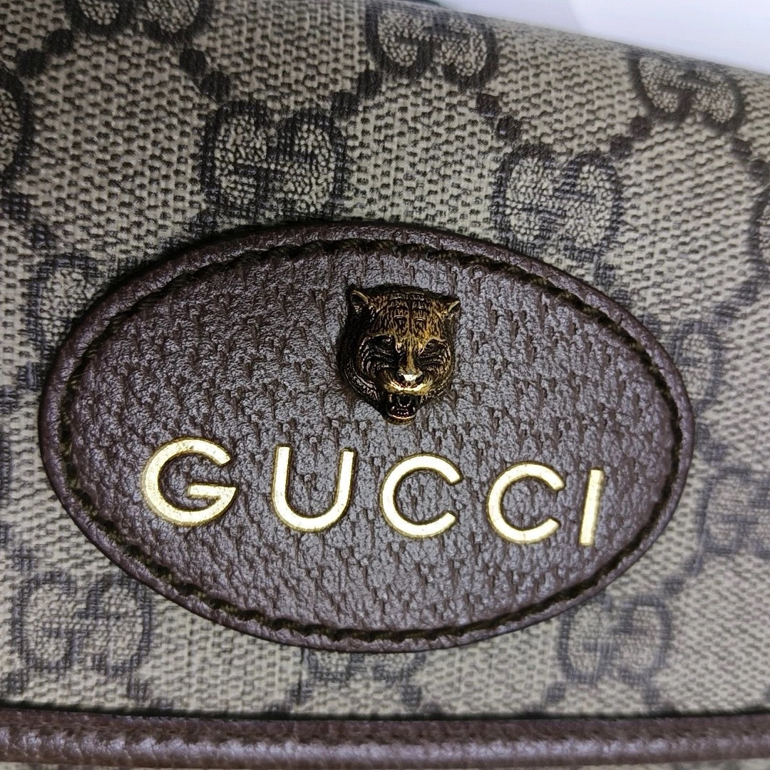 preloved gucci gg canvas supreme crossbody bag with tiger head and logo in gold in pristine condition 
