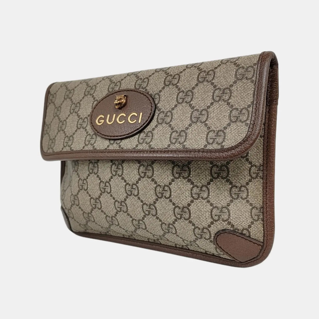 the side view of gucci gg canvas supreme in brown and gucci logo and tiger head