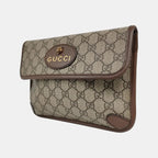 the side view of gucci gg canvas supreme in brown and gucci logo and tiger head