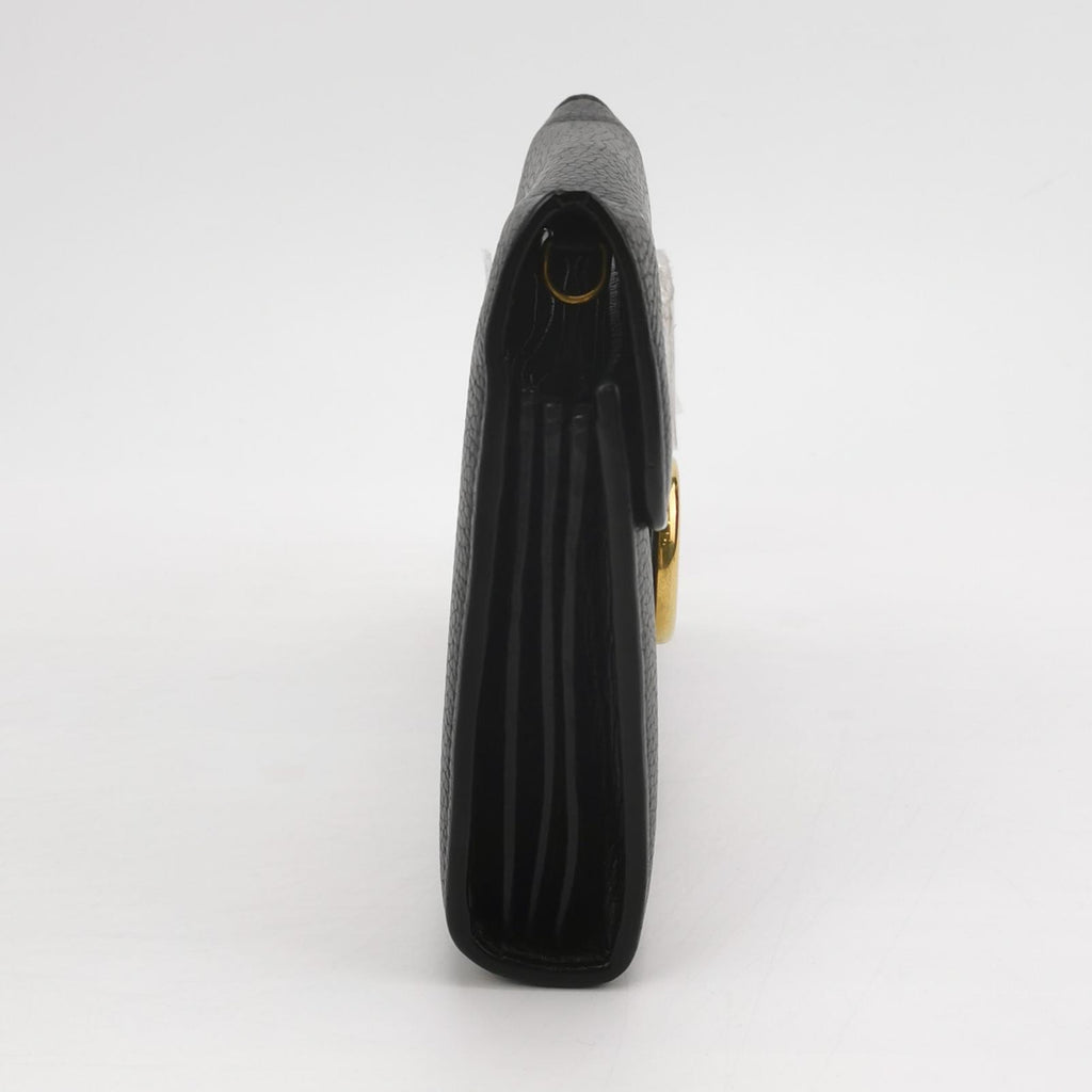 side view of gucci interlock small bag in black leather and good condition