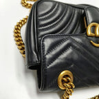 Black quilted handbag with gold chain strap on black leather gucci bag in good condition