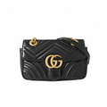front view of the gucci marmont small leather bag in black and in great condition and gold hardware for sale 