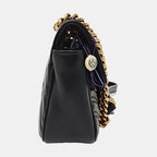the side view of black gucci marmont with gold hardware in great condition