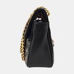 the side view of gucci marmont black with gold hardware in good condition