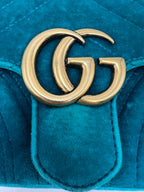 the detail gold gg hardware logo of gucci small marmont in blue velvet in excellent condition 
