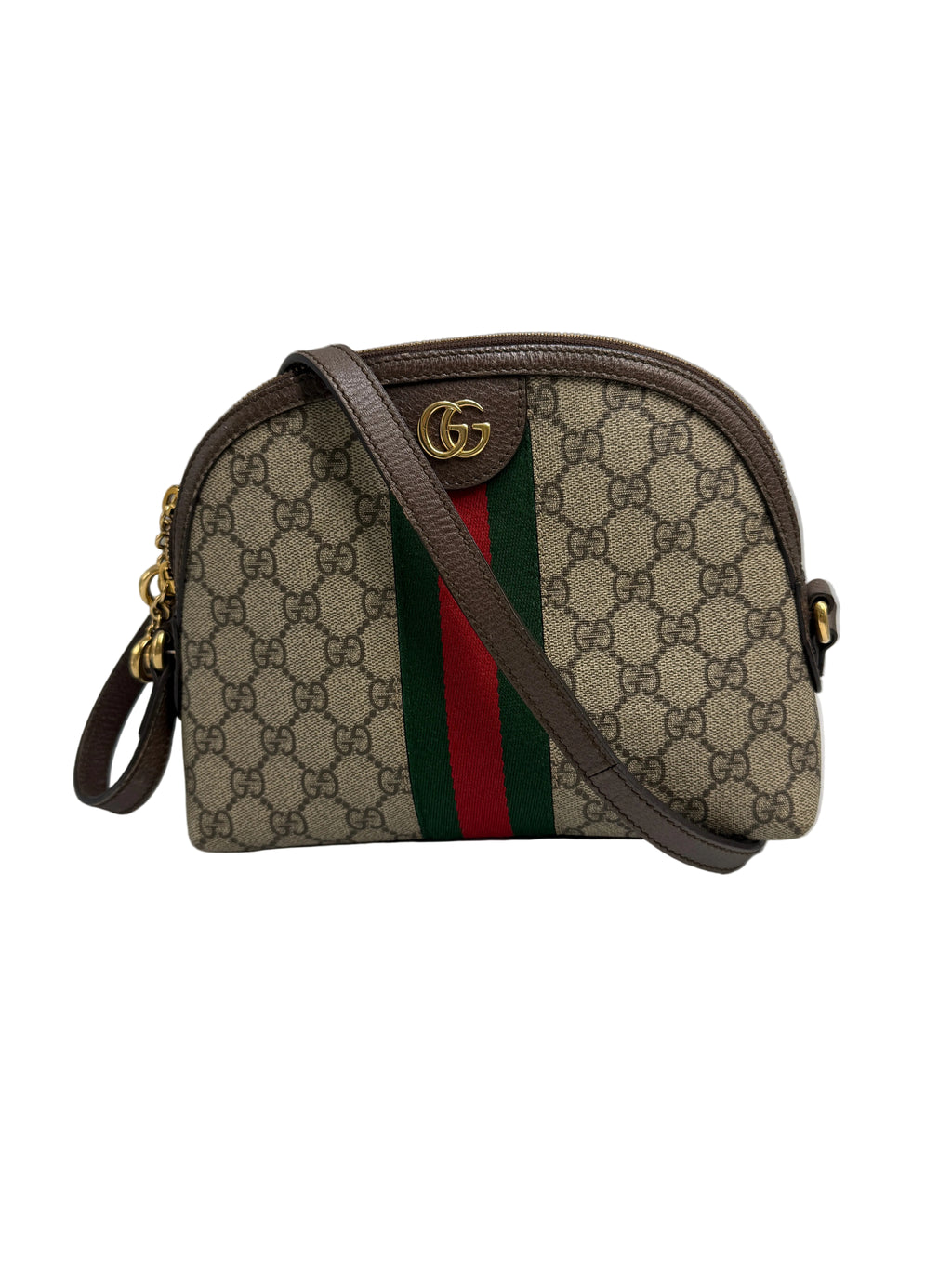 A Gucci GG Supreme dome-shaped shoulder bag in beige and brown monogram canvas with a brown leather trim, a green and red web stripe down the center, and a gold-tone interlocking GG logo on the front.