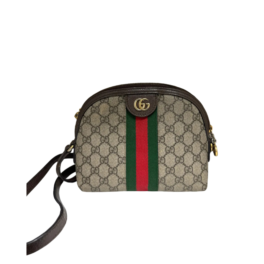 Front view of a Gucci Ophidia dome shoulder bag in beige GG Supreme canvas with brown leather trim and green and red Web stripe.