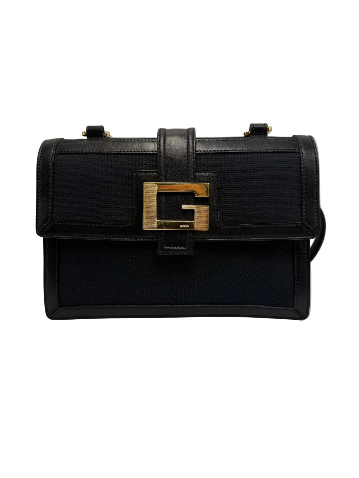 Front view of a vintage Gucci flap shoulder bag in black canvas and leather featuring a gold-tone Square G buckle
