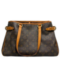 Front view of a vintage Louis Vuitton Batignolles Horizontal tote bag in Monogram canvas with tan vachetta shoulder straps and side buckles.