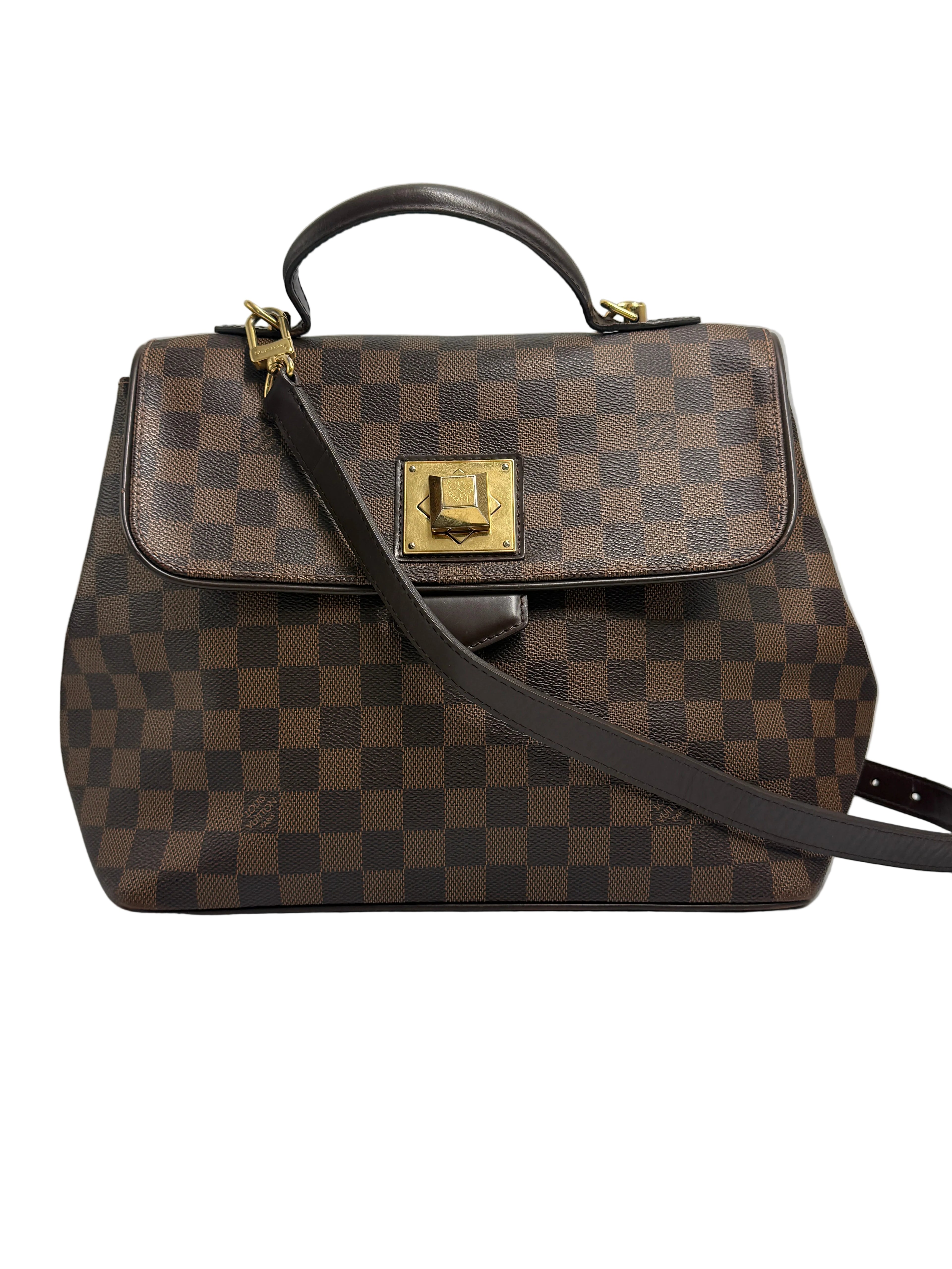 Front view of a Louis Vuitton Bergamo MM handbag in Damier Ébène canvas with a top handle, shoulder strap, and gold twist lock.