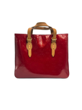 Front view of a Louis Vuitton Columbus tote bag in Rouge Fauviste Monogram Vernis patent leather with tan vachetta leather handles.