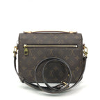 Back view of LV Pochette Métis highlighting the exterior zipped pocket and Monogram print.